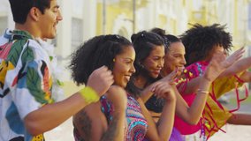 Carnival Dance Harmony: Friends Bonding in Choreographed Joy on Brazilian Streets, Celebratory Costumes and Smiles in the Sunlight. - Powered by Shutterstock - Get 15% off with code: PIKWIZARD15