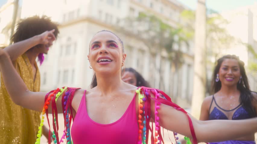 Radiant Woman with Friends Dancing with Joy at Brazilian Carnival, Celebratory Mood in Street Parade Royalty-Free Stock Footage #3433682151
