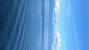 a journey across the Pacific Ocean on a liner, only the sea and water and the sky are visible, everything is blue, the horizon and a small part of the ship, rest on the water. High quality 4k footage