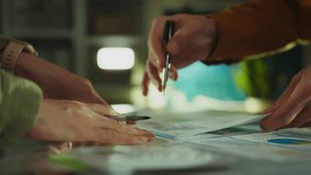 In an authentically decorated office, an Asian professional brainstorms, inspiring his colleagues to think creatively. The meeting focuses on productive finance and discussions about business concepts - Powered by Shutterstock - Get 15% off with code: PIKWIZARD15