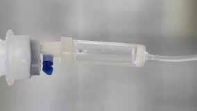 Serum dropper for a sclerotherapy treatment in a clinic. Close up. Vertical video.