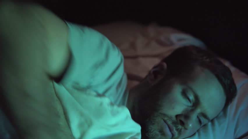 Insomnia Problem For A Man Who Cannot Sleep At Night, Sleepless And Stressed Insomniac. Young White Caucasian Man In 30's. A Variety Of Camera Angles Available. 
 Royalty-Free Stock Footage #34337824