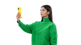 Caucasian Woman Uses Smartphone For Video Call On White Background