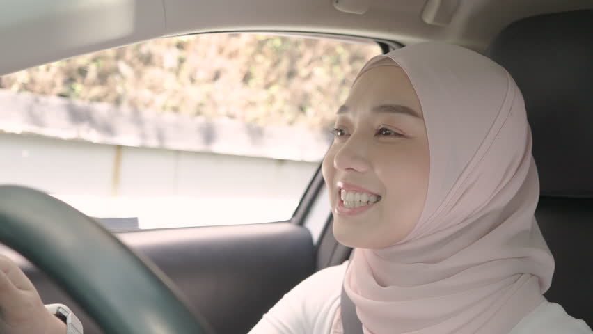 Contactless payment. Beautiful Asian Muslim woman pay for food or drinks via smart watch using barcode reader scanning barcode by driving through or drive thru. Pretty female Islamic wearing tradition Royalty-Free Stock Footage #3433792583
