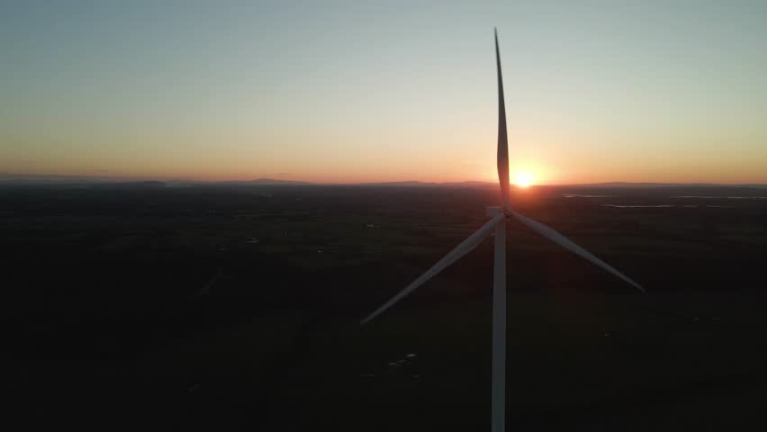 A Wind Turbine Against the Backdrop of the Sunset in the Midlands of Ireland - Close Up