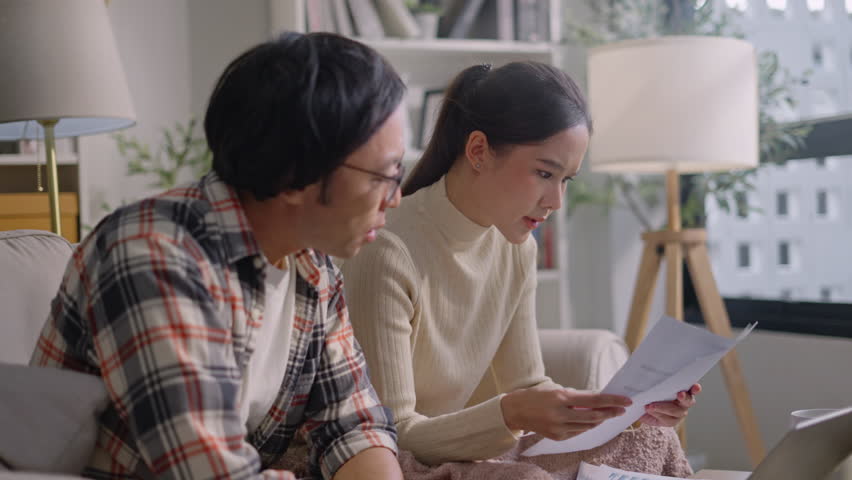 upset millennial couple counting overspent budget,Unhappy young woman feeling stressed calculating monthly expenses at home,lack of money for utility household or rental payments, bankruptcy concept Royalty-Free Stock Footage #3433871019
