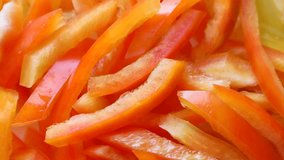 Bright red, orange and yellow bell pepper slices circle rotation close up top view - Powered by Shutterstock - Get 15% off with code: PIKWIZARD15
