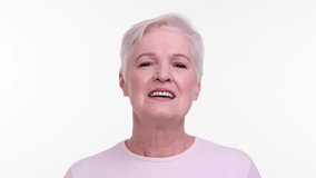 Elderly positive woman talking to camera on white background - Powered by Shutterstock - Get 15% off with code: PIKWIZARD15