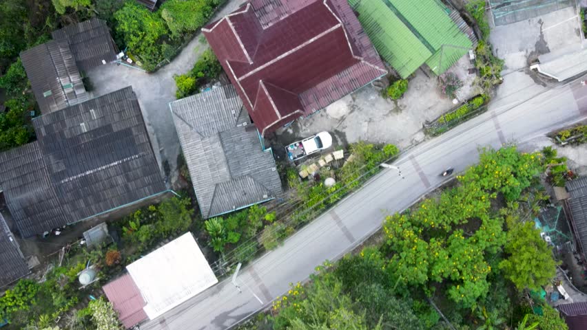 Aerial Birds Eye View Flying Over Mae Kampong Village Rooftop Buildings Located At Chiang Mai Province. Push Forward Shot Royalty-Free Stock Footage #3433981021