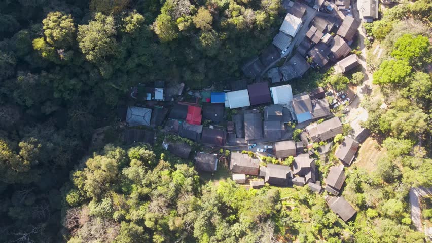 Aerial Birds Eye View Mae Kampong Village Rooftop Buildings Located At Chiang Mai Province. Dolly Shot, Establishing  Royalty-Free Stock Footage #3433981109