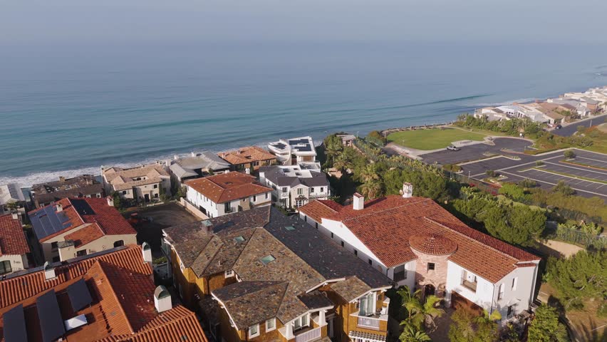 Aerial of beachside mansions in Southern California at sunrise