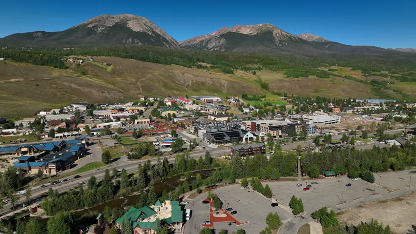 Colorado Summer Rocky mountain town aerial drone cinematic Silverthorne outlets downtown bridge fishing Blue River Lake Dillon Green Mountain Reservoir fly fishing paradise forward motion slowly