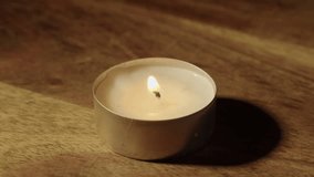 Close-up view: Burning flame on tea candle is blown out, extinguished - Powered by Shutterstock - Get 15% off with code: PIKWIZARD15