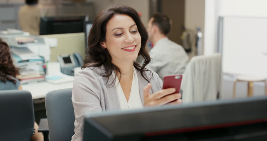 Businesswoman, phone and internet connection in office, scrolling and browsing on website for research. Female person, networking and happy for notification, online and mobile app for communication
