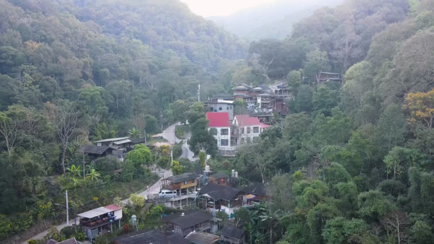  Mae Kampong Village Buildings Nestled In Forest Valley In Chiang Mai Province. Aerial Push Forward Shot Royalty-Free Stock Footage #3434087039