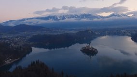 4K morning panorama video of lake Bled, Slovenia. A very famous tourist destination with the lake and in the middle of the lake is a island with a Church.
