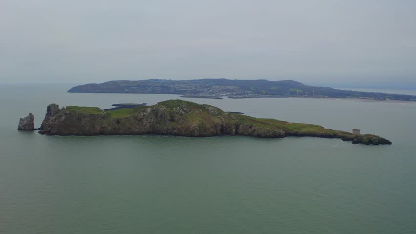 Vast vista of Ireland's eye island and Howth. Beautiful aerial shot. Royalty-Free Stock Footage #3434262351