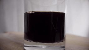 Slow motion of pouring milk into black coffee. Black coffee mixed with milk, coffee art concept - Powered by Shutterstock - Get 15% off with code: PIKWIZARD15