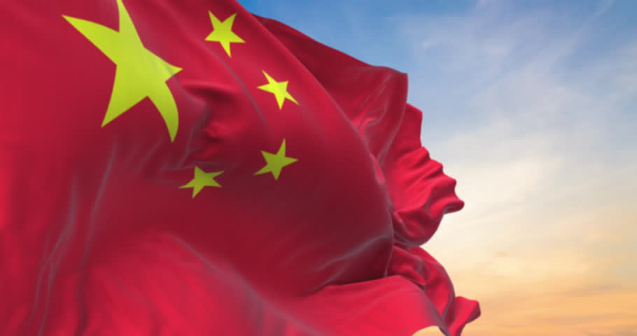Detailed close up of the national flag of China waving in the wind on a sundown, seamless loop and slow motion animation