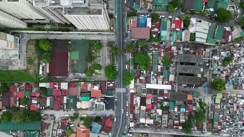 Dense residential area in west crame, quezon city, philippines, showcasing varied rooftops, streets, and urban planning, aerial view