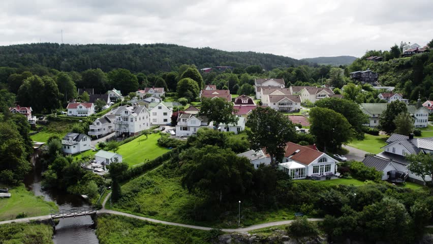 Ljungskile village with traditional houses and green landscapes, aerial view