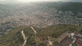 Aerial drone footage captures the stunning cityscape of Zacatecas from Cerro de la Bufa, descending to reveal the historic center's narrow streets and alleys. Explore the beauty of Mexico from above