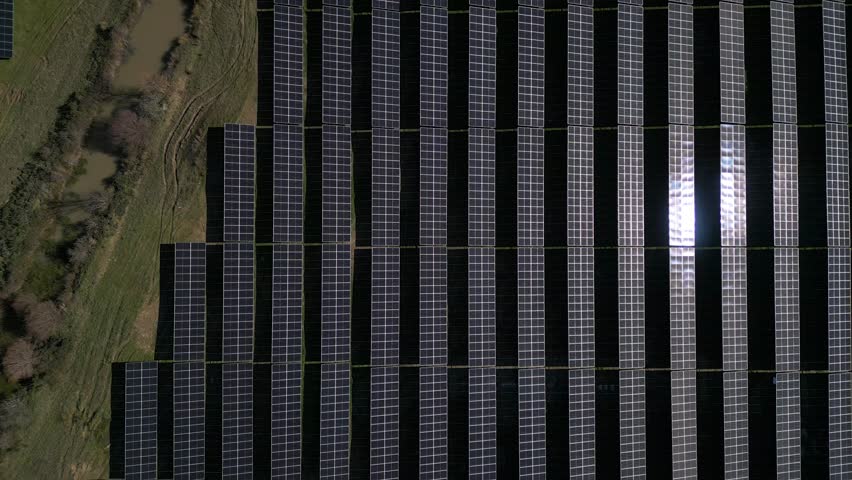 Aerial Grid of Solar Panels Harnessing Clean Energy - aerial top view