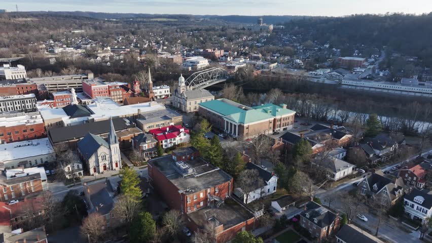 Downtown Frankfort Kentucky the Kentucky River and historical building and the Singing Bridge leadin the the Frankfort state capital building AERIAL DOLLY