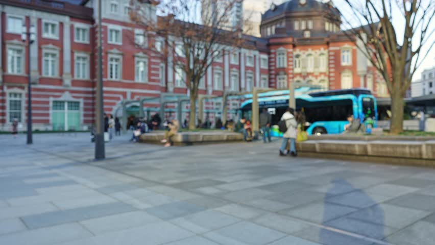 Scenery of Tokyo station square. Blurred image.