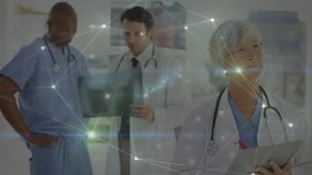 Animation of glowing communication network over diverse male and female doctors at work in hospital. Data, network, hospital, healthcare, teamwork and communication, digitally generated video.