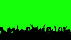 Crowd silhouette of people at a club concert or sports event. Green screen for compositing and presentation. - Powered by Shutterstock - Get 15% off with code: PIKWIZARD15