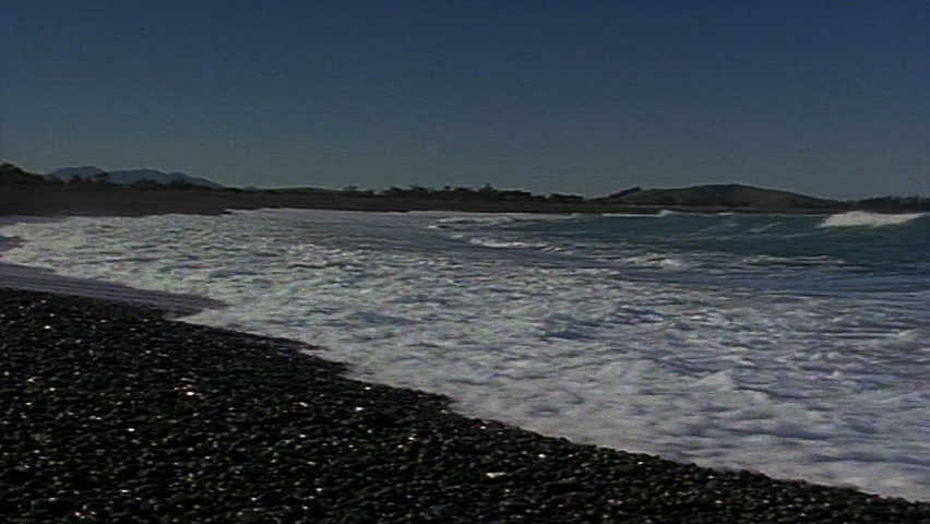 waves crashing against beach