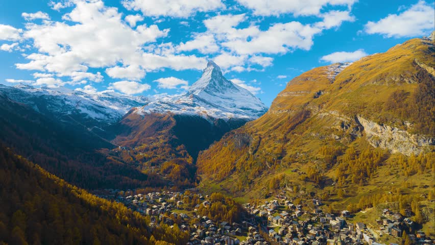 Hyper lapse or drone time lapse aerial view of Zermatt village in autumn season with beautiful landscape of Matterhorn, Most popular travel destination in Switzerland. Royalty-Free Stock Footage #3434950169