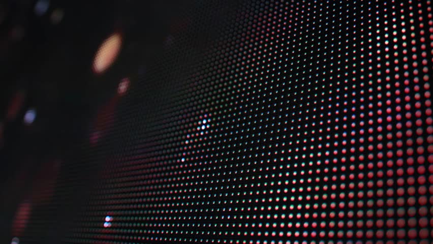 An RGB LED screen is a type of display that uses different LEDs to create a full spectrum of colors. Modern screen, background, macro