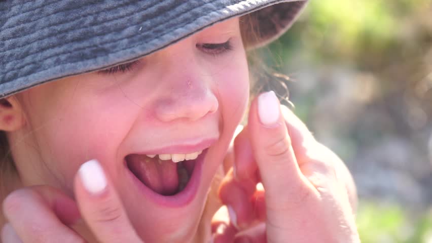 chips, eating - happy Girl enjoys chips, in Lavender fields with fragrant purple flowers bloom at sunset, garden setting during daytime, snack time captured.