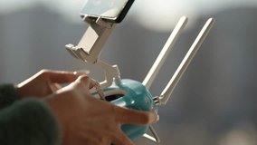 UAV Drone Remote Control. Copter Remote Control. Pilot Controlling Drone Use Joystick. Modern Technology Video Shooting Camera. Drone Controller. Pilot Fly On UAV. Aerial Device UAV Drone Controller  - Powered by Shutterstock - Get 15% off with code: PIKWIZARD15