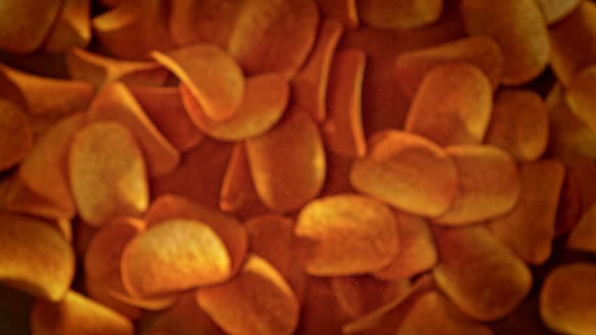 Super Slow Motion Shot of Premium Potato Chips And Seasoning Powder Explosion at 1000fps.