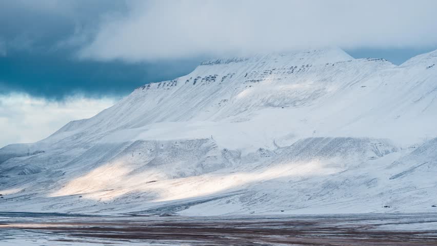 Arctic, Snow Covered, Polar Mountain Timelapse. Winter Frozen Ground Continent Snowy Frost Rock. Climate Change Theme.