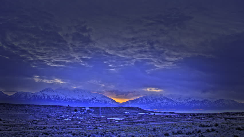 Time lapse of a tone mapped sunrise over the mountains.