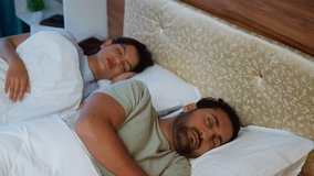 handheld shot of Indian Married Couples sleeping peacefully at night in comfortable on bed at bedroom - concept of relaxation, togetherness and wellbeing - Powered by Shutterstock - Get 15% off with code: PIKWIZARD15