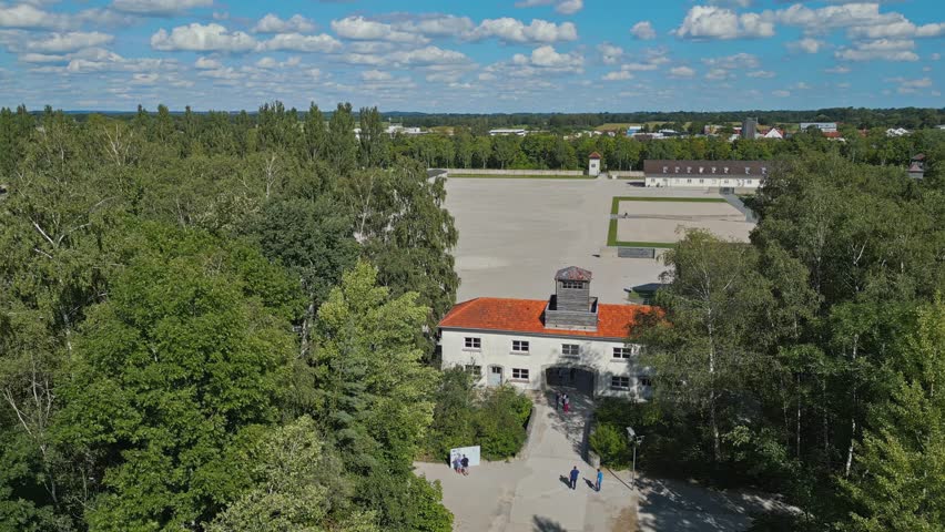 Dachau Concentration Camp, Munich, Germany, Wide Establishing Drone, Summer, Sunny Day, Beautiful Cloudscape  Royalty-Free Stock Footage #3435160735