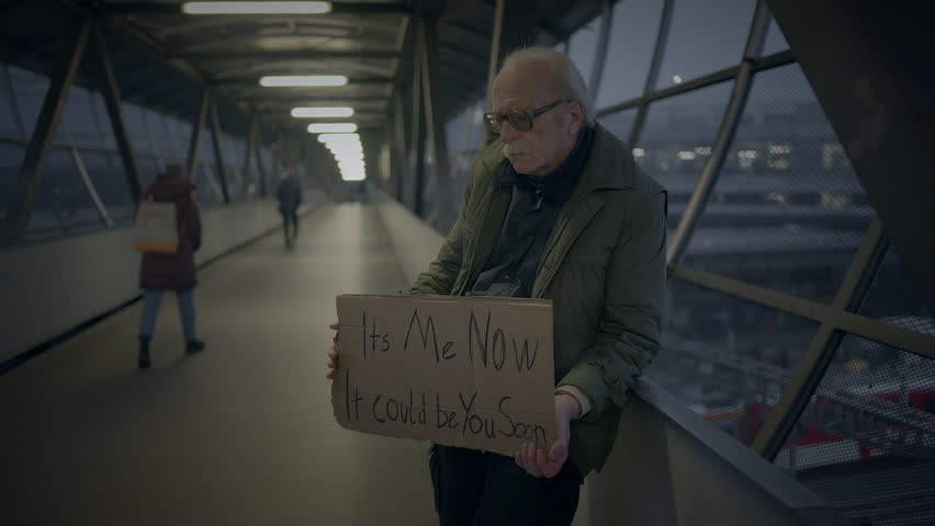 Elderly Homeless Man Suffering from Poverty Looking for Help at Train Station