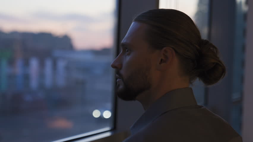 Thinking relaxing mindfulness pensive thoughtful Caucasian businessman at evening office looking at window car traffic automobile city view think contemplating business man dreaming decide solution Royalty-Free Stock Footage #3435197573