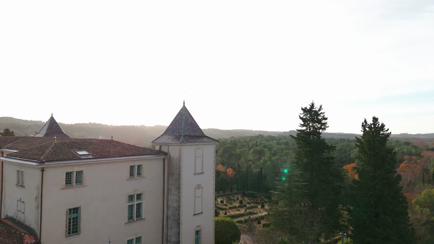 Slow establishing shot of a styled gardens at departmental area of restinclieres