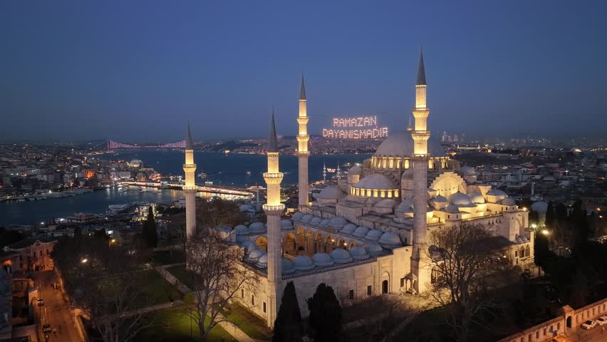 Happy Ramadan Feast Text in the Suleymaniye Mosque, Illuminated Letters Between Minarets (Mahya) Drone Video, Suleymaniye Fatih, Istanbul Turkey Royalty-Free Stock Footage #3435258771