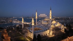 Happy Ramadan Feast Text in the Suleymaniye Mosque, Illuminated Letters Between Minarets (Mahya) Drone Video, Suleymaniye Fatih, Istanbul Turkey