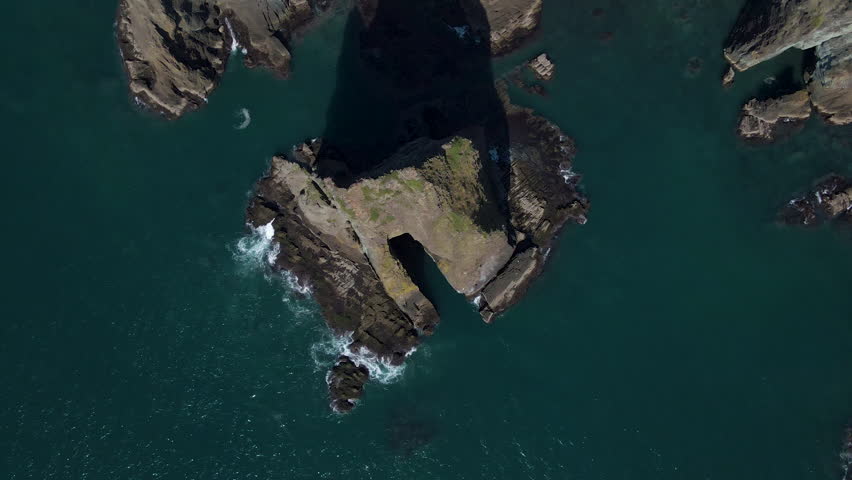 Cinematic aerial shot of coastal cliffs in Muroran city in Hokkaido, Japan