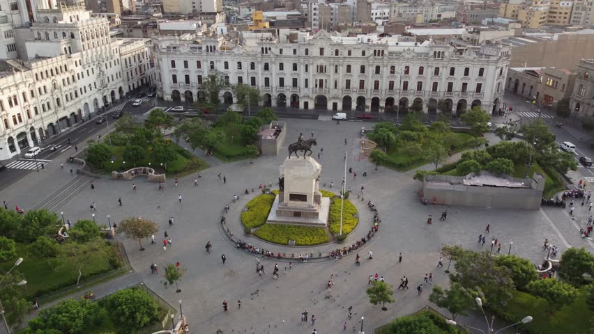 Aerial view of San Martin square with monument. Tourists and people gathered at Plaza San Martin in the historic center of Lima capital of Peru Royalty-Free Stock Footage #3435334977