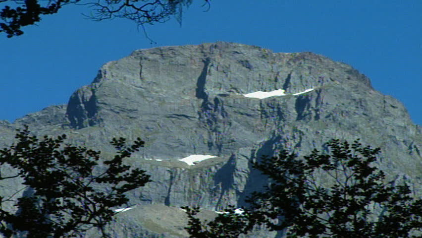 Pan out to reflection of rocky outcropping