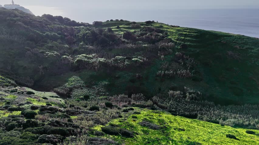 Aerial view Flying over the green cliffs at Cabo da Roca, Sintra Cascais Natural Park, Portugal